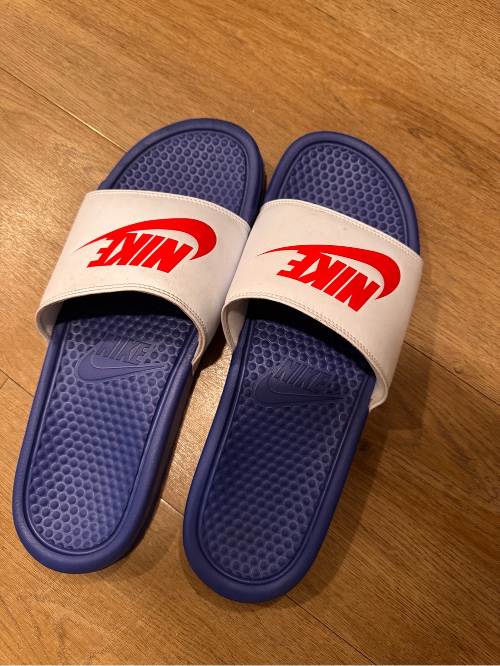 Nike White Strap Slide Sandals with Red Logo and blue Footbed